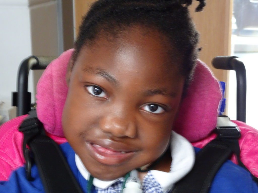 Portrait of a young girl in a wheelchair