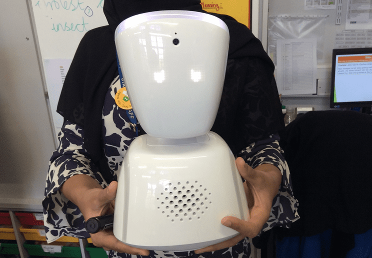 Teacher holding a robot