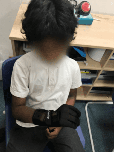 Boy with signing glove