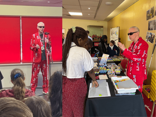 Clarke Reynolds, Braille Artist on stage and holding a braille art workshop at Communication Works 2023.