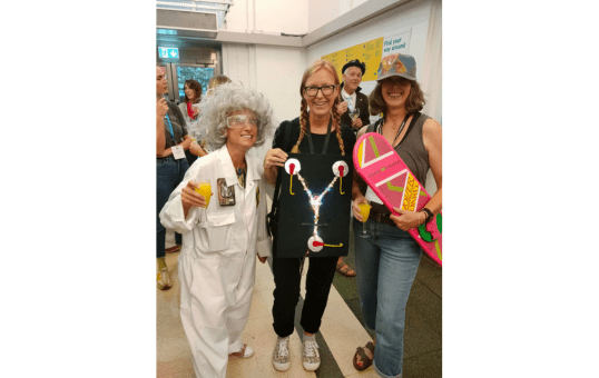 Mary Long and friends dressed in Back to the Future themed costumes at Communication Matters 2023 conference