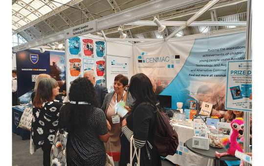 Advisory teachers David Howard and Maureen De Longhi talking to visitors on the CENMAC stand at Tes SEND Show