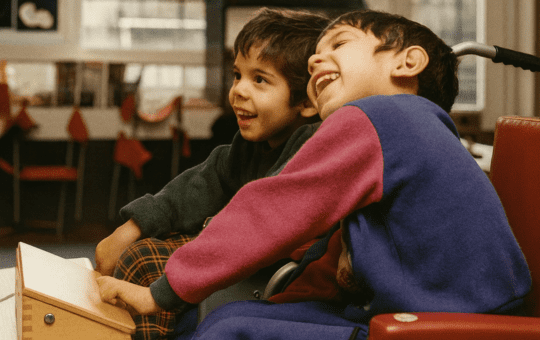 CENMAC Archive - Two pupils playing with a wooden switch