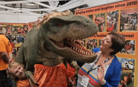 Advisory Teacher Maureen making friends with a dinosaur Advisory Teacher Maureen making friends with a dinosaur