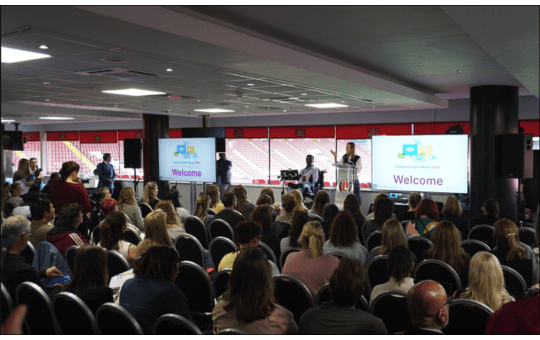 Kathryn Stowell and Abdi Omar on stage at Communication Works 2025