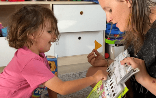 Child using AAC to support her communication