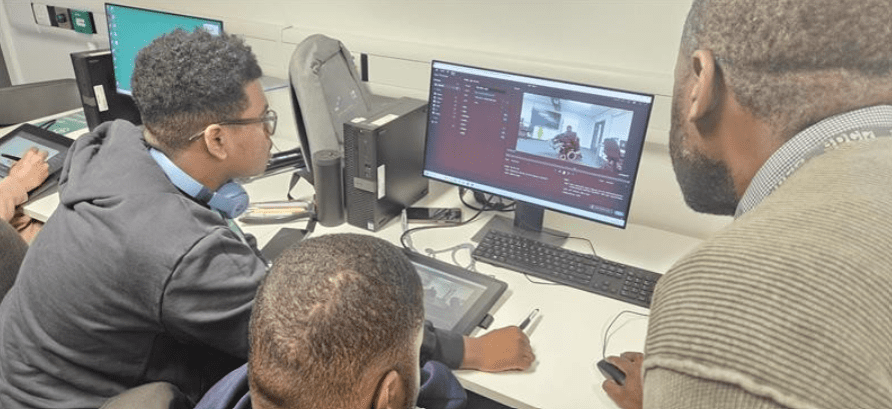 Kelson and his technology with college staff