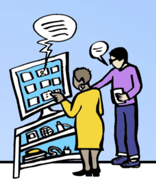 Two people using a large computer screen